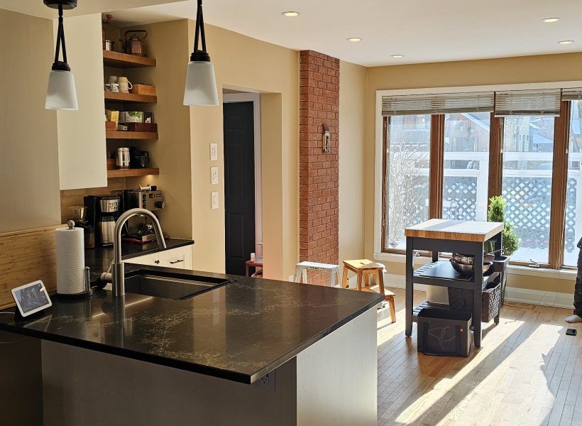 The result is a beautifully redesigned kitchen that not only looks stunning but also enhances the overall flow and functionality of the home. The seamless connection to the dining room creates an inviting space perfect for both everyday living and entertaining.