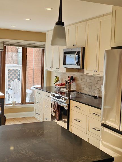 The new kitchen features sleek, modern cabinets that provide both elegance and ample storage. We complemented these with striking black granite countertops, which add a touch of sophistication and durability.
