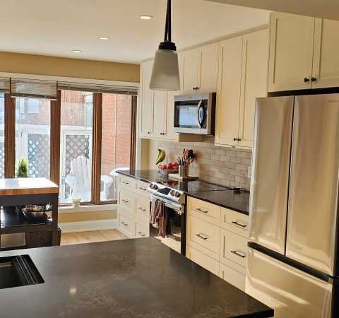 The new kitchen features sleek, modern cabinets that provide both elegance and ample storage. We complemented these with striking black granite countertops, which add a touch of sophistication and durability.