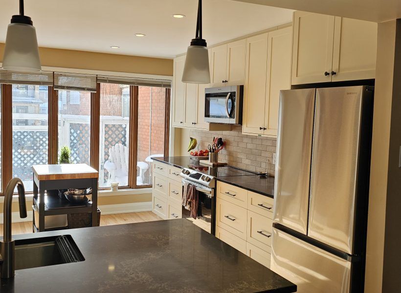 The new kitchen features sleek, modern cabinets that provide both elegance and ample storage. We complemented these with striking black granite countertops, which add a touch of sophistication and durability.