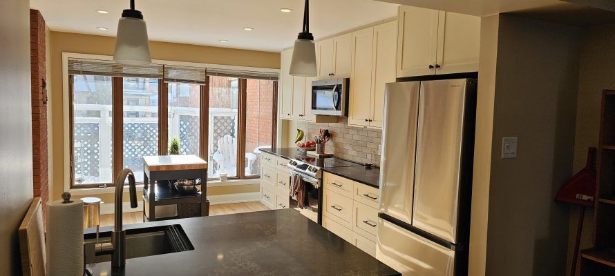 The new kitchen features sleek, modern cabinets that provide both elegance and ample storage. We complemented these with striking black granite countertops, which add a touch of sophistication and durability.
