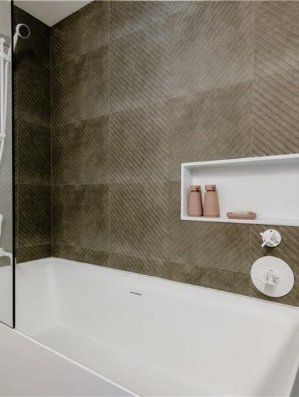 The renovation included the creation of two new washrooms, featuring contemporary fixtures and finishes, and a custom-designed kitchen that perfectly blends functionality with style.