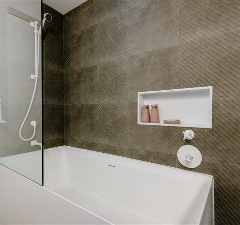 The renovation included the creation of two new washrooms, featuring contemporary fixtures and finishes, and a custom-designed kitchen that perfectly blends functionality with style.