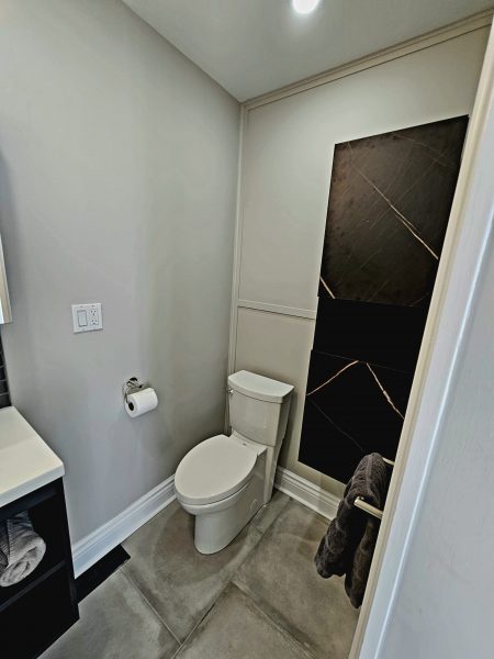 The renovated washroom now boasts a stunning new shower with state-of-the-art fixtures and a streamlined design. The space has been carefully crafted to provide both visual appeal and enhanced functionality, making it a luxurious retreat for daily use. The transformation not only resolved the previous issues but also elevated the overall style of the main floor washroom, reflecting our commitment to quality and diligence. The result is a beautifully modern washroom that perfectly aligns with the clients' vision and enhances their home experience.