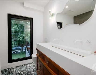 The renovation included the creation of two new washrooms, featuring contemporary fixtures and finishes, and a custom-designed kitchen that perfectly blends functionality with style.