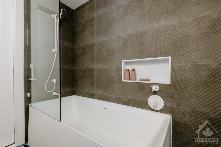 The renovation included the creation of two new washrooms, featuring contemporary fixtures and finishes, and a custom-designed kitchen that perfectly blends functionality with style.