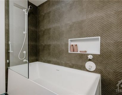 The renovation included the creation of two new washrooms, featuring contemporary fixtures and finishes, and a custom-designed kitchen that perfectly blends functionality with style.