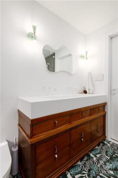 The renovation included the creation of two new washrooms, featuring contemporary fixtures and finishes, and a custom-designed kitchen that perfectly blends functionality with style.