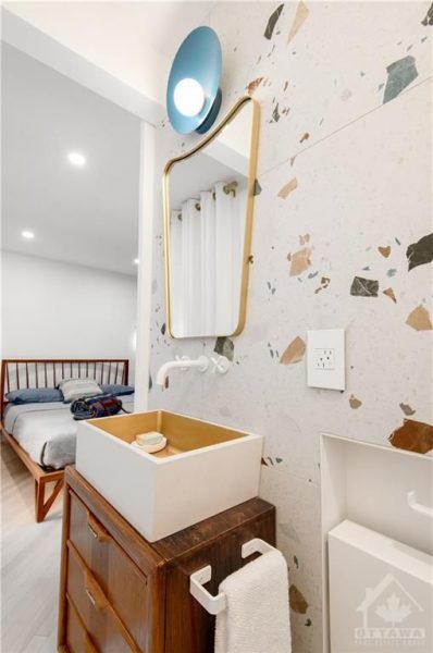 The renovation included the creation of two new washrooms, featuring contemporary fixtures and finishes, and a custom-designed kitchen that perfectly blends functionality with style.