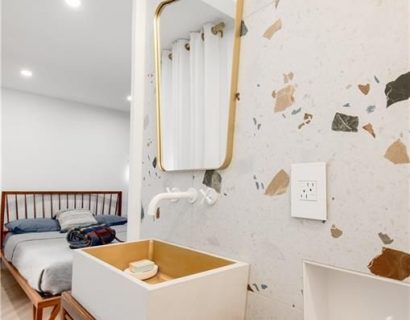 The renovation included the creation of two new washrooms, featuring contemporary fixtures and finishes, and a custom-designed kitchen that perfectly blends functionality with style.